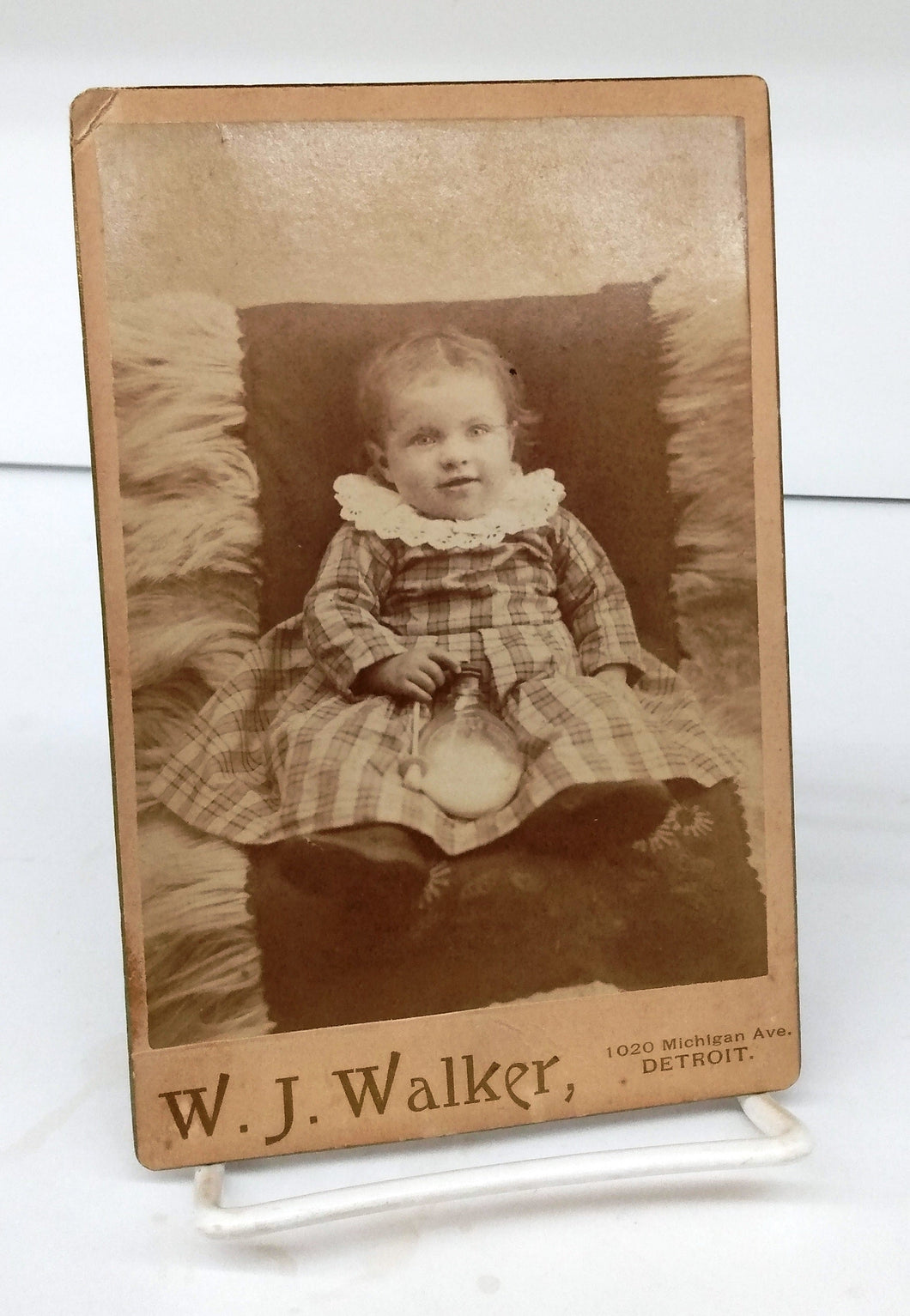 Photo of child with early baby bottle