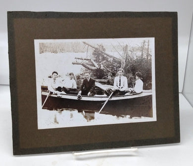 Photo of group seated in boat