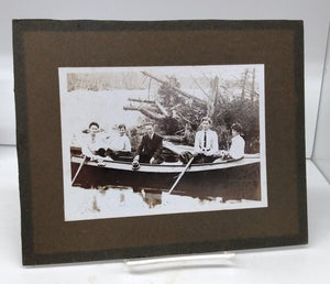 Photo of group seated in boat