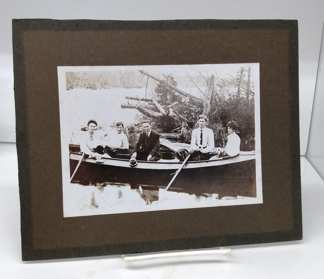 Photo of group seated in boat