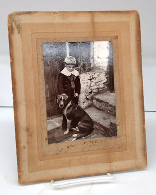 Photograph of little boy with dog