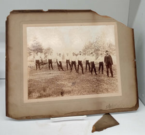 Photograph of firemen with hose-reel cart