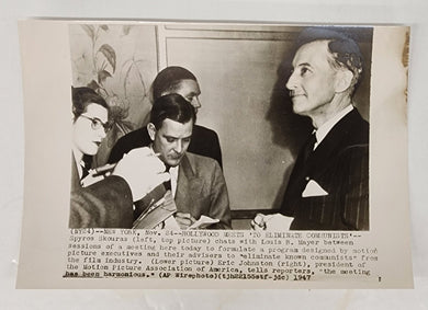 Photo of Eric Johnston, President of the Motion Picture Association of America, with reporters