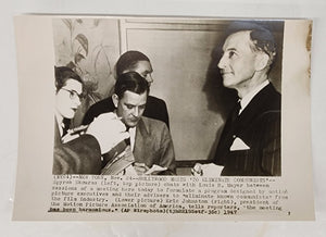 Photo of Eric Johnston, President of the Motion Picture Association of America, with reporters