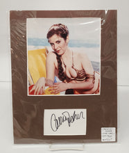 Colour photo of Carrie Fisher with signed card