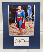 Colour photo of Christopher Reeve with signed card