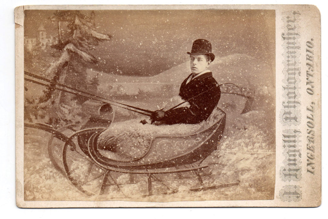 Photo of young man in artistic backdrop "sleigh"