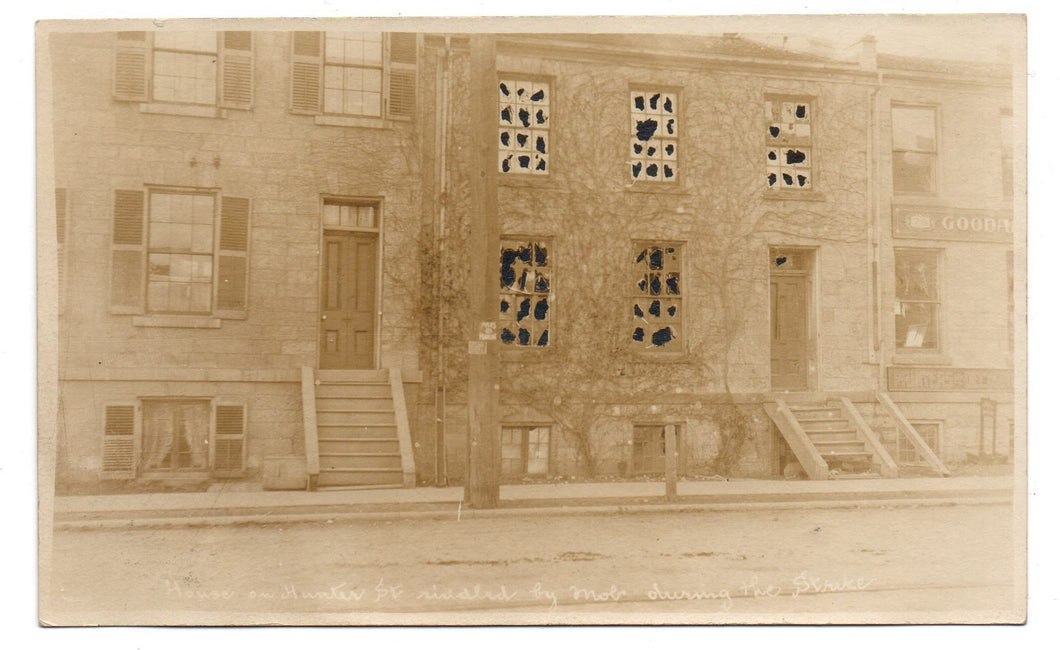 Photo postcard of building damaged during Hamilton, Ontario Street Railway strike