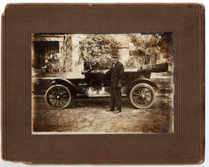 Photo of Charlie McTevia and automobile