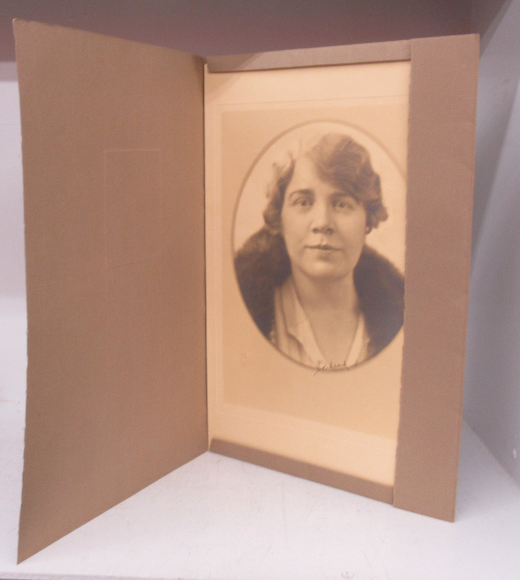 Portrait of an unknown woman in grey folder